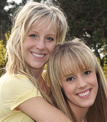 photo of smiling mother and daughter